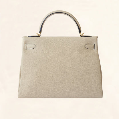 Hermès | Trench Togo Retourne Kelly - Gold Hardware | 32