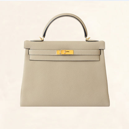 Hermès | Trench Togo Retourne Kelly - Gold Hardware | 32